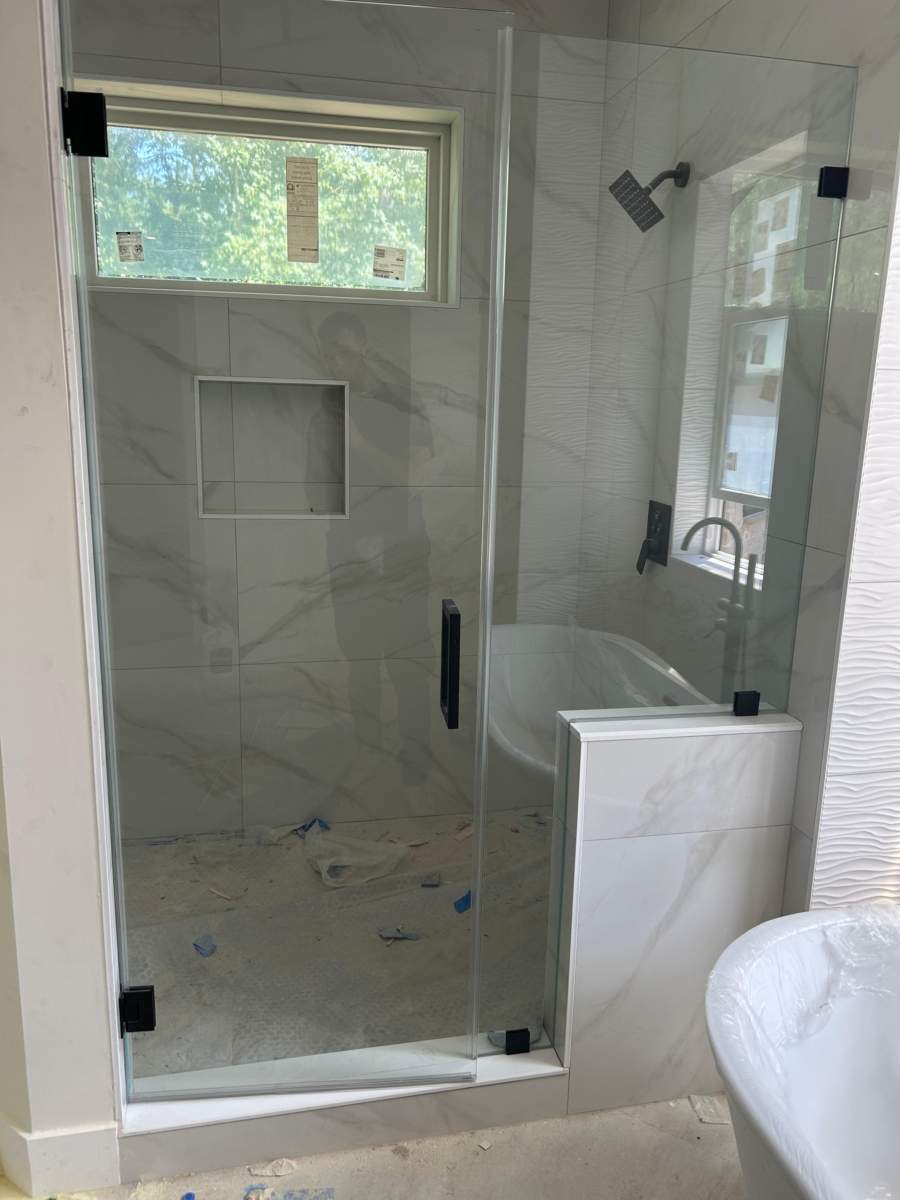 Frameless shower glass door installation in master bathroom